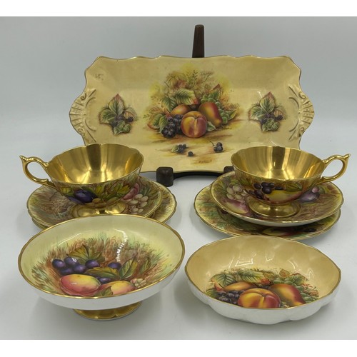423 - Aynsley Orchard Gold c746 pattern to include 2 x cups, 2 x saucers 1 x plate 16cm d all signed D. Jo... 