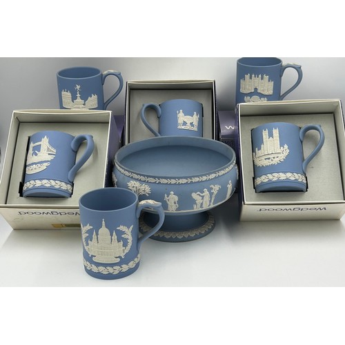 442 - Wedgwood blue jasperware to include a footed fruit bowl 20cm d x 13cm h and 6 x Christmas Mugs 11cm ... 