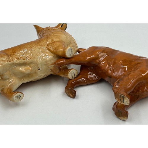 447 - A collection of Beswick dogs to include Pembroke Corgi, Cocker Spaniel, Springer Spaniel, German She... 