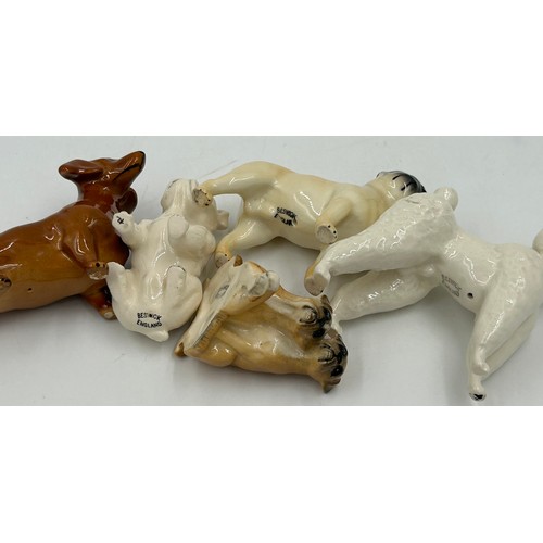 447 - A collection of Beswick dogs to include Pembroke Corgi, Cocker Spaniel, Springer Spaniel, German She... 