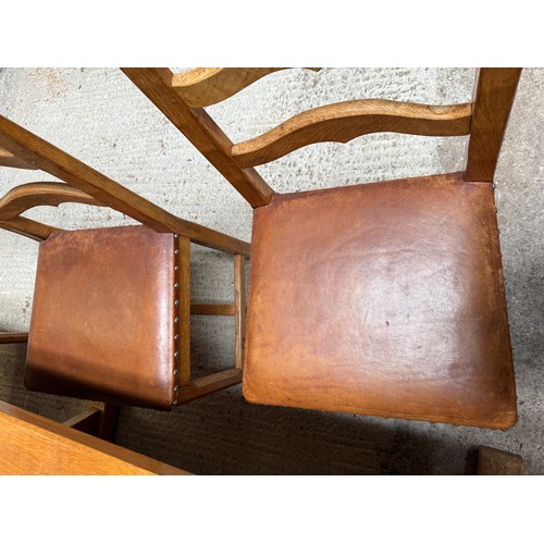 207 - An Alan ‘Acornman’ Grainger refectory dining table and six leather seated chairs including two carve... 