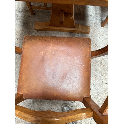 207 - An Alan ‘Acornman’ Grainger refectory dining table and six leather seated chairs including two carve... 