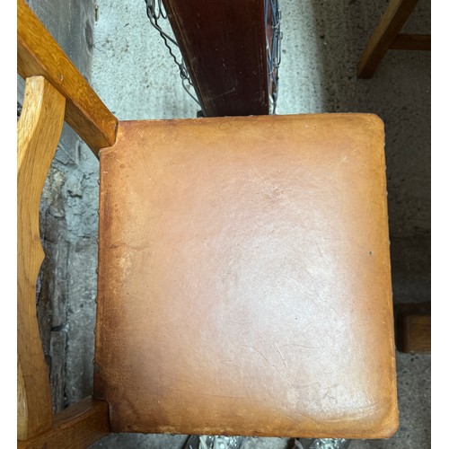 207 - An Alan ‘Acornman’ Grainger refectory dining table and six leather seated chairs including two carve... 