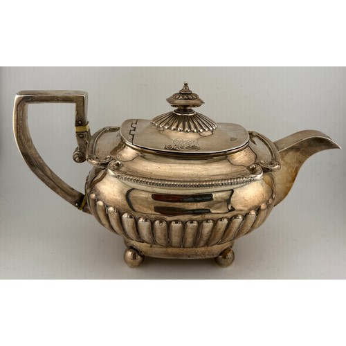 Hallmarked silver teapot, London 1807, maker Robert Hennell I and Samuel Hennell. Ivory heat diffusers. Weight 821gm.