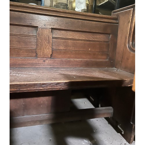 10 - A 19thC oak pew with floral roundel to one end by Sir George Gilbert Scott. Removed from St Mary Chu... 