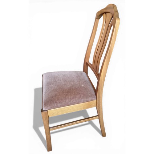 14 - A mid 20thC teak Nathan extending dining table and four Parker Knoll chairs. 206cm l extended, 152cm... 