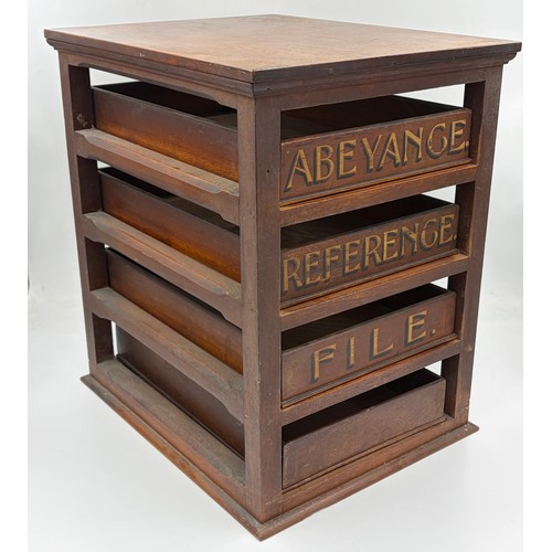 19 - A vintage wooden cabinet featuring four drawers, three with stencilled text to front, Abeyance, Refe... 