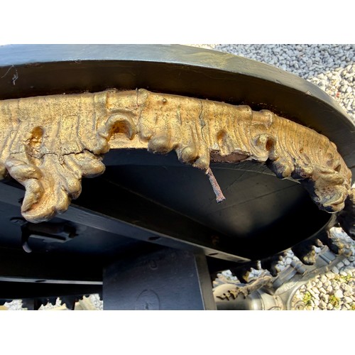 20 - A 19thC tilt top occasional table with painted marbled circular top on black and gilt decorative tri... 
