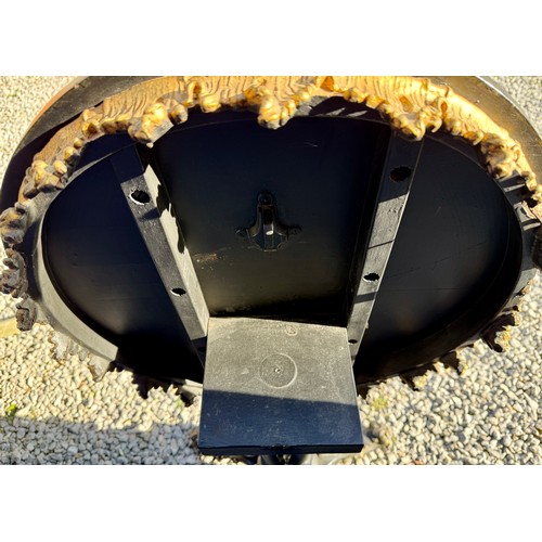 20 - A 19thC tilt top occasional table with painted marbled circular top on black and gilt decorative tri... 