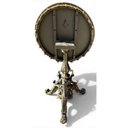 20 - A 19thC tilt top occasional table with painted marbled circular top on black and gilt decorative tri... 