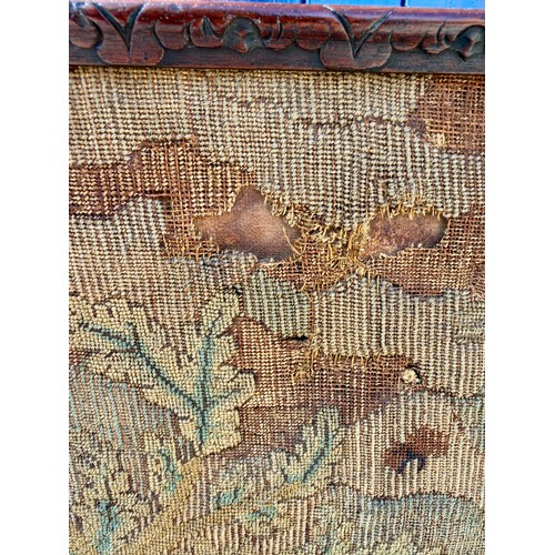 21 - A 19thC mahogany adjustable pole screen with needlework decoration to one side and decoupage to the ... 