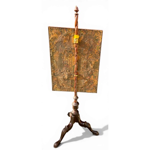 21 - A 19thC mahogany adjustable pole screen with needlework decoration to one side and decoupage to the ... 