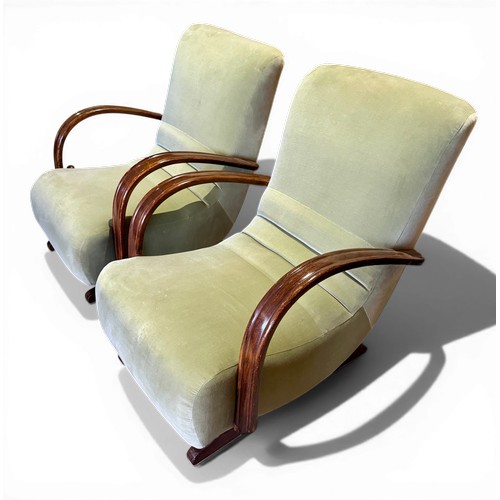 23 - Two oak framed velvet upholstered adjustable rocking armchairs. 66cm w arm to arm.