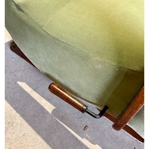 23 - Two oak framed velvet upholstered adjustable rocking armchairs. 66cm w arm to arm.