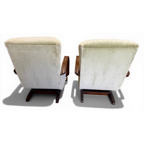 23 - Two oak framed velvet upholstered adjustable rocking armchairs. 66cm w arm to arm.