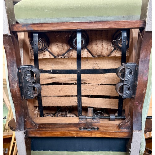 23 - Two oak framed velvet upholstered adjustable rocking armchairs. 66cm w arm to arm.