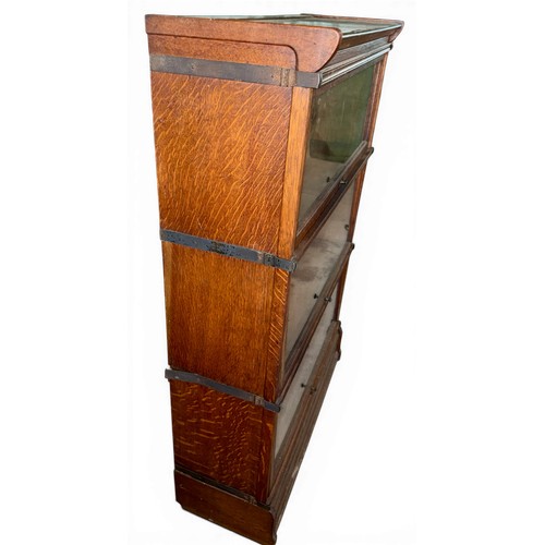 27 - A three height oak Inglesants sectional bookcase. 87cm w x 31cm d x 130cm h.