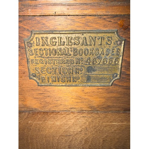 27 - A three height oak Inglesants sectional bookcase. 87cm w x 31cm d x 130cm h.