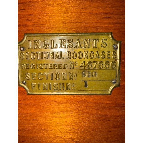 27 - A three height oak Inglesants sectional bookcase. 87cm w x 31cm d x 130cm h.