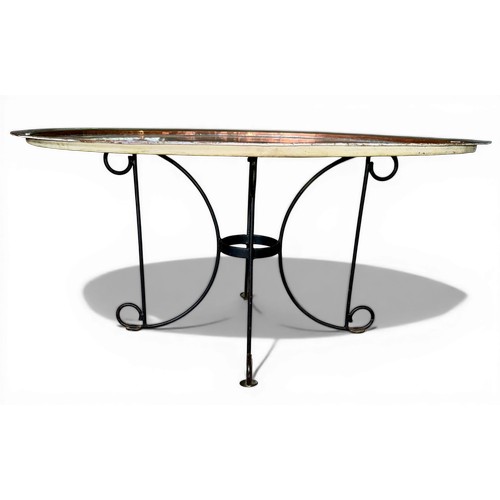 29 - A circular copper topped table on later metal base. 80cm d x 39cm h.