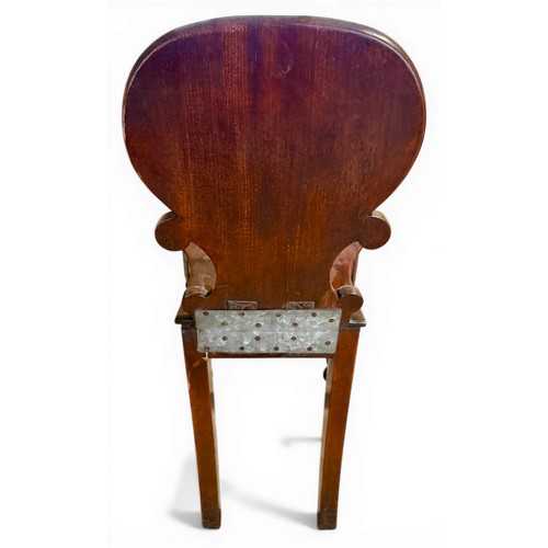 30 - A 19thC mahogany hall chair with shell shaped back. Height to back 83cm.