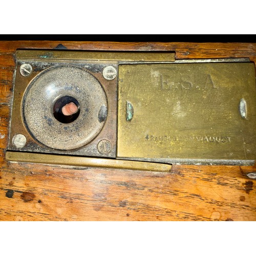 32 - A 19thC mahogany school desk with cupboard to back and inkwell to the top marked E.S.A. 42A Holborn ... 