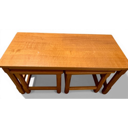 37 - A nest of three oak tables made by ‘Carthorse’. Largest 91cm x 43cm x 45cm h.