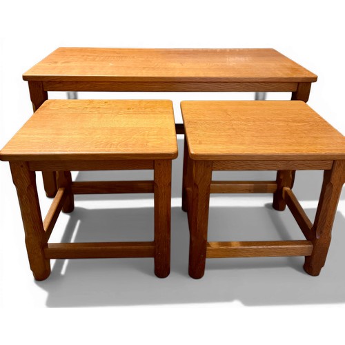 37 - A nest of three oak tables made by ‘Carthorse’. Largest 91cm x 43cm x 45cm h.