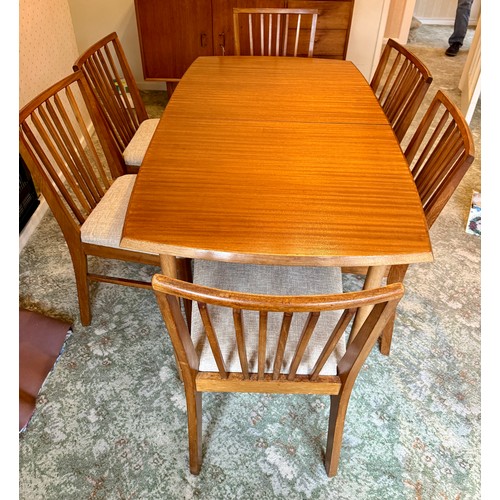 40 - A mid 20thC Vanson teak extending dining table and six chairs. Closed 139 x 82w, extended 181cm l.