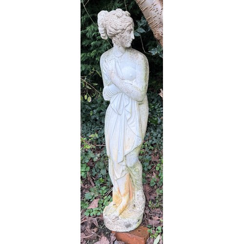 9 - A reconstituted stone figure of a female. 130 cm h.