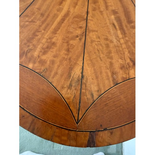54 - An Edwardian oval satinwood side table. 74 w x 48 d x 71cm h.