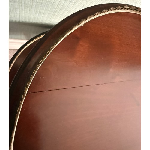 60 - A 20thC mahogany two tier table with gilt metal mounts. 50 d x 85cm h.