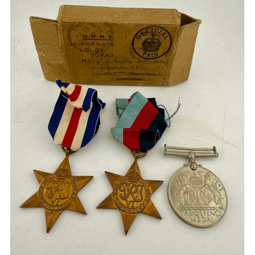 621 - World War II medals in original box comprising The Defence Medal, The France and Germany Star and Th... 