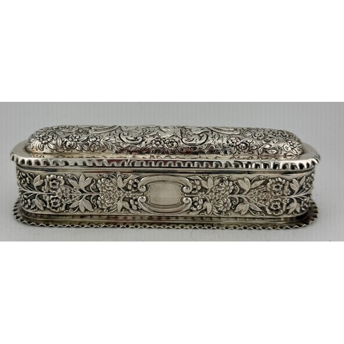 497 - Hallmarked silver lidded box with repoussé decoration and vacant cartouche, the interior with three ... 