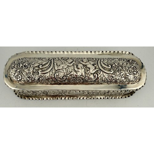 497 - Hallmarked silver lidded box with repoussé decoration and vacant cartouche, the interior with three ... 