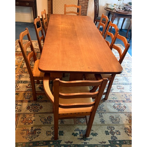 106A - An Alan 'Acornman' Grainger refectory table 212cm l x 87cm w and 8 leather covered chairs with ladde... 