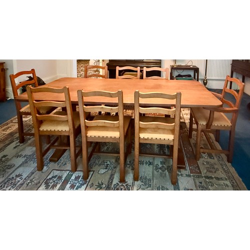 106A - An Alan 'Acornman' Grainger refectory table 212cm l x 87cm w and 8 leather covered chairs with ladde... 