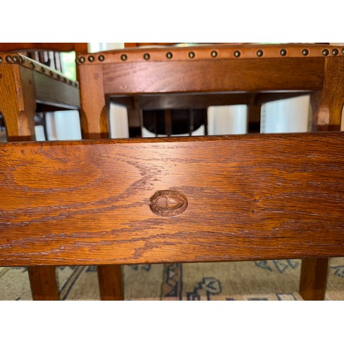 106A - An Alan 'Acornman' Grainger refectory table 212cm l x 87cm w and 8 leather covered chairs with ladde... 