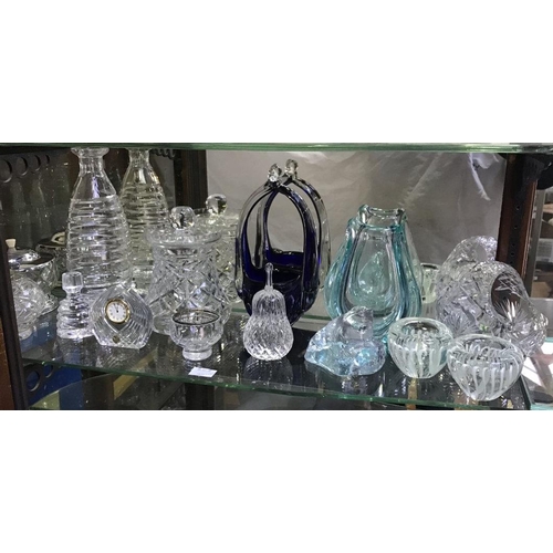 62 - A shelf of assorted glass including a decanter and stopper of spiral design, together with a bohemia... 
