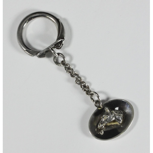 83 - A silver key ring with horse-head pendant, pendant baring makers mark 'C&C', hallmarked Birmingham, ... 
