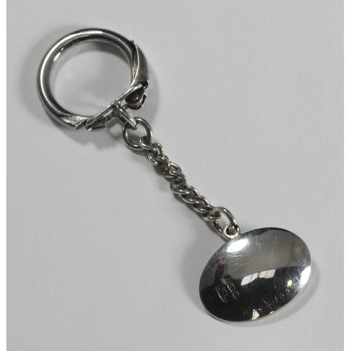 83 - A silver key ring with horse-head pendant, pendant baring makers mark 'C&C', hallmarked Birmingham, ... 