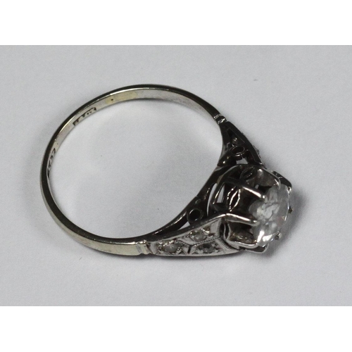 107 - A platinum diamond ring, centrally claw set with a round, transitional cut diamond, total diamond we... 