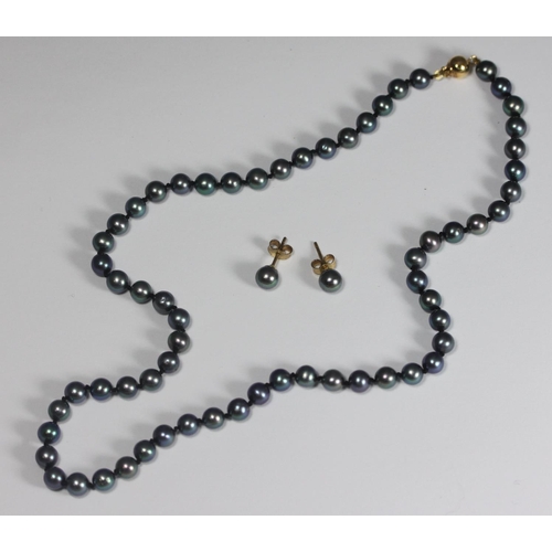 111 - A black-tinted cultured pearl necklace with 9ct gold globular safety clasp, together with a pair of ... 