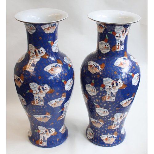 60 - A large pair of modern Chinese porcelain floor vases, of baluster form with flared rims, painted in ... 