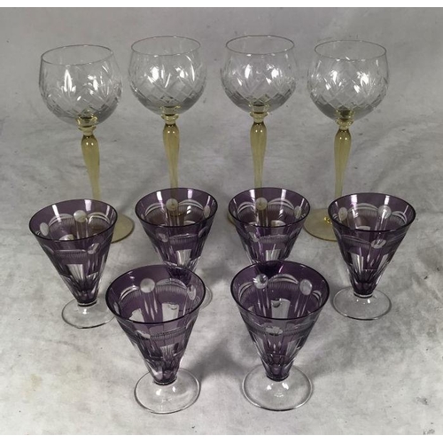 63 - A set of six Art Deco cocktail glasses decorated with swags to plum coloured ground, together with a... 