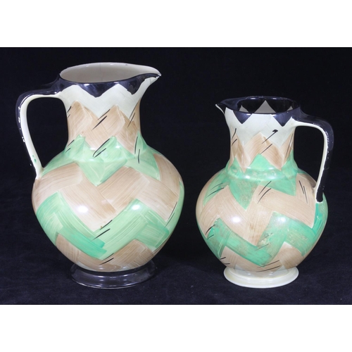 46 - Two graduated Myott. Son & Co Art Deco pottery jugs, each painted with a beige and green 'zig-zag' d... 