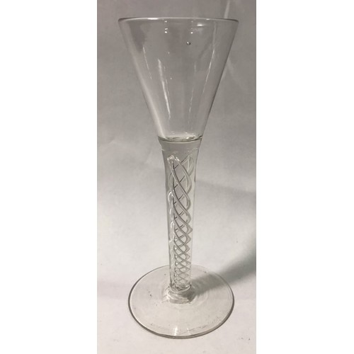 72 - An 18th century cordial glass with conical bowl and multi-twist clear glass stem, ground pontil mark... 