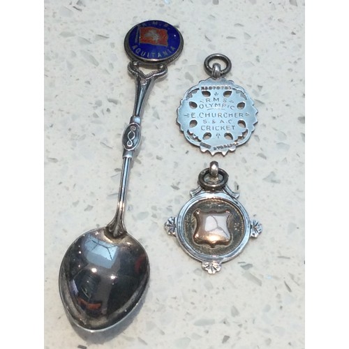 97 - A silver and enamel spoon RMS Aquitania, and two gold and silver sports medals from RMS Olympic, tog... 