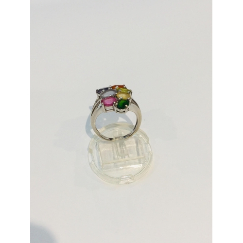 188 - A 9ct white gold multi gemstone dress ring, set with seven various oval coloured stones, weighing 4.... 