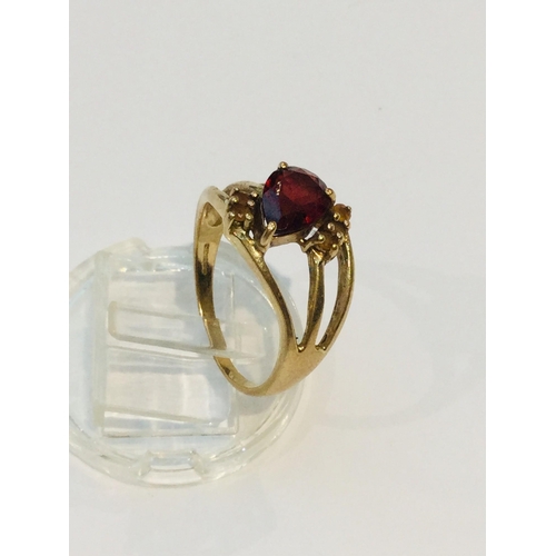 189 - A 9ct yellow gold dress ring, set with a large opaque ruby in a four claw setting, ring weighs 5.8 g... 